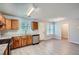 Well-lit kitchen with wood cabinets, granite countertops, and stainless steel appliances at 7078 Ravenwood Ln, Lithonia, GA 30038