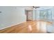 Bright living room with hardwood floors, neutral walls, and a ceiling fan at 7078 Ravenwood Ln, Lithonia, GA 30038