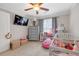 Adorable Bedroom with a crib, dresser, and cozy seating area, creating a warm and inviting space at 1039 Fern Se Ave, Atlanta, GA 30315
