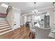 Open-concept dining area with hardwood floors, modern lighting, and seamless transition to the kitchen at 1039 Fern Se Ave, Atlanta, GA 30315