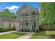 Charming two-story home featuring double porches, well-manicured lawn and walkway leading to the front entrance at 1039 Fern Se Ave, Atlanta, GA 30315