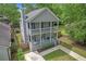Charming two-story home featuring double porches, well-manicured lawn and walkway leading to the front entrance at 1039 Fern Se Ave, Atlanta, GA 30315
