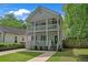 Charming two-story home featuring a double porch, freshly painted exterior, and manicured lawn at 1039 Fern Se Ave, Atlanta, GA 30315