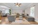 Spacious living room features hardwood floors, comfortable sectional seating and neutral paint at 1039 Fern Se Ave, Atlanta, GA 30315