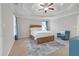 Bright main bedroom with a decorative rug, ceiling fan, and stylish furniture at 1039 Fern Se Ave, Atlanta, GA 30315