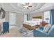 Spacious main bedroom featuring a ceiling fan, en-suite and access to the backyard at 1039 Fern Se Ave, Atlanta, GA 30315