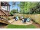 Private backyard with fire pit and comfortable seating, ideal for outdoor gatherings at 114 Karland Nw Dr, Atlanta, GA 30305