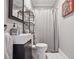 Modern bathroom with sleek vanity, unique shelving, patterned shower curtain, and neutral color scheme at 114 Karland Nw Dr, Atlanta, GA 30305