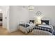 Bright bedroom with twin beds, neutral walls, and light carpet at 114 Karland Nw Dr, Atlanta, GA 30305