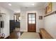 Mudroom with hardwood floors, charming wood bench, decorative accents, and access to kitchen at 114 Karland Nw Dr, Atlanta, GA 30305