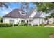 Beautifully landscaped home with a mix of siding and brick, complemented by lush greenery at 114 Karland Nw Dr, Atlanta, GA 30305