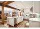 Open-concept kitchen boasts a large island, marble countertops, and stainless steel appliances at 114 Karland Nw Dr, Atlanta, GA 30305