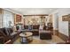 Open living room features hardwood floors, comfortable seating, neutral paint, natural light, and open floor plan at 114 Karland Nw Dr, Atlanta, GA 30305