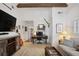 Inviting living room with exposed beams, white shiplap walls, comfortable seating, and stylish decor at 114 Karland Nw Dr, Atlanta, GA 30305