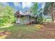Exterior view of a raised deck overlooking the grassy backyard at 185 Wyngate Ct, Dallas, GA 30157