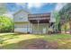 View of the back of house with a large deck and expansive backyard at 185 Wyngate Ct, Dallas, GA 30157