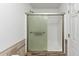 Bathroom featuring a tiled shower with a glass door at 185 Wyngate Ct, Dallas, GA 30157