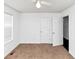Neutral bedroom with plush carpet, ceiling fan and natural light from a window at 185 Wyngate Ct, Dallas, GA 30157