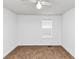 A minimalist bedroom featuring neutral carpet and a ceiling fan at 185 Wyngate Ct, Dallas, GA 30157