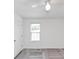 Bedroom with white walls, laminate flooring, a ceiling fan and natural light from the window at 185 Wyngate Ct, Dallas, GA 30157