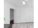 White bedroom with laminate flooring, a ceiling fan, and two closets at 185 Wyngate Ct, Dallas, GA 30157