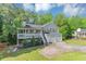 Charming home featuring a covered porch, two car garage and mature trees at 185 Wyngate Ct, Dallas, GA 30157