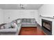 Cozy living room featuring a fireplace, hardwood floors, and modern lighting at 185 Wyngate Ct, Dallas, GA 30157