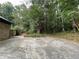 A view of the backyard showing the tree line at the back of the property at 1935 Lamp Post Ln, Lawrenceville, GA 30043