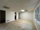 Large basement space with tiled floors, an exterior window, and doorway at 1935 Lamp Post Ln, Lawrenceville, GA 30043