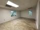 Spacious room with tile floors and two windows that provide an ample amount of natural light at 1935 Lamp Post Ln, Lawrenceville, GA 30043