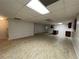 Spacious unfinished basement featuring tile floors, white walls, and a drop ceiling at 1935 Lamp Post Ln, Lawrenceville, GA 30043