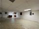 Unfinished basement space with neutral paint, recessed lighting, and tile flooring at 1935 Lamp Post Ln, Lawrenceville, GA 30043