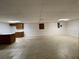 Finished basement featuring a wet bar, tile flooring, and ample space for entertaining at 1935 Lamp Post Ln, Lawrenceville, GA 30043