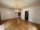 Traditional dining room showcases hardwood floors and chandelier lighting at 1935 Lamp Post Ln, Lawrenceville, GA 30043
