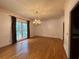 Bright dining room with large windows and elegant chandelier at 1935 Lamp Post Ln, Lawrenceville, GA 30043