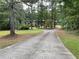 Long driveway splits surrounded by trees at 1935 Lamp Post Ln, Lawrenceville, GA 30043