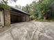 Open garage with a driveway leading up to the entrance at 1935 Lamp Post Ln, Lawrenceville, GA 30043