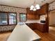 Well-lit kitchen area boasting wood cabinets, hardwood floors, and a lengthy breakfast bar at 1935 Lamp Post Ln, Lawrenceville, GA 30043