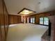 Expansive living room boasts natural light and elegant fireplace with brick surround at 1935 Lamp Post Ln, Lawrenceville, GA 30043