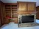 Living room features built-in shelving, a fireplace and a television at 1935 Lamp Post Ln, Lawrenceville, GA 30043