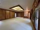 Spacious living room featuring unique ceiling skylight and beautiful wood paneling at 1935 Lamp Post Ln, Lawrenceville, GA 30043