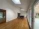 Bright sunroom featuring wood floors, many windows, skylights, and a billiards table at 1935 Lamp Post Ln, Lawrenceville, GA 30043