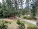 Scenic view of long driveway leading to home at 1935 Lamp Post Ln, Lawrenceville, GA 30043