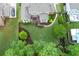 Aerial view of the property's backyard featuring a cozy deck and a meticulously maintained lawn at 225 Sundance Dr, Woodstock, GA 30188