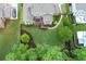 Aerial view of backyard that features a spacious lawn, deck, and landscaped planting beds at 225 Sundance Dr, Woodstock, GA 30188