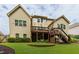 Spacious backyard with a two-story deck and a well-manicured lawn at 225 Sundance Dr, Woodstock, GA 30188