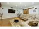 Finished basement with comfortable lounging area, bar seating and a large-screen TV at 225 Sundance Dr, Woodstock, GA 30188