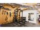 Basement gym featuring a Powertec power rack and dumbbell set for fitness enthusiasts at 225 Sundance Dr, Woodstock, GA 30188