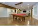 Finished basement boasting pool table, custom bar and ample seating for entertaining at 225 Sundance Dr, Woodstock, GA 30188
