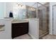Bathroom with tiled shower and floors and a dark wood vanity with granite countertop at 225 Sundance Dr, Woodstock, GA 30188